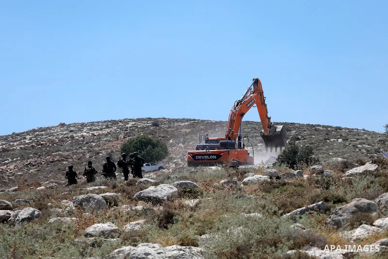 Palestinians take part in a protest against plans to confiscate land for settlement expansion in Khirbet Humsa, west of Hebron in the occupied West Bank, on June 9, 2026. Local sources said Israeli forces dispersed the d...