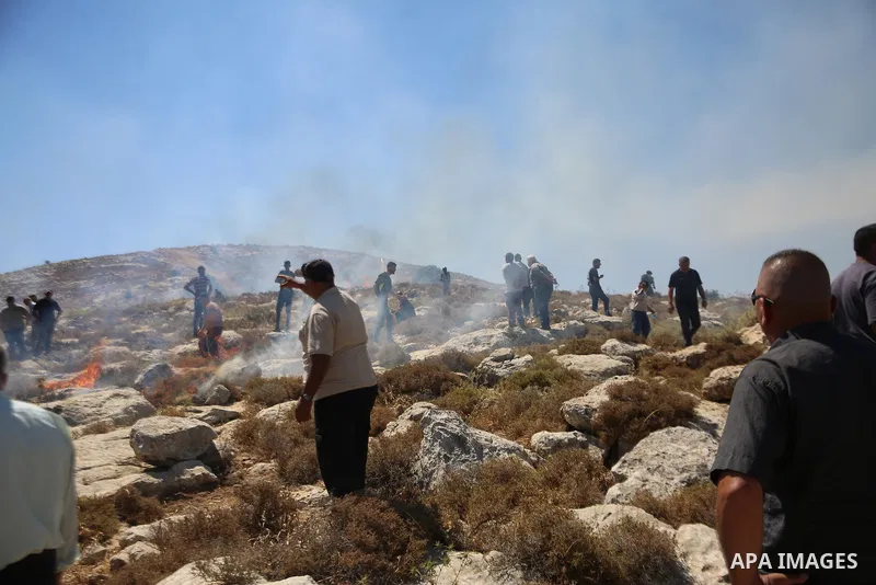 Palestinians take part in a protest against plans to confiscate land for settlement expansion in Khirbet Humsa, west of Hebron in the occupied West Bank, on June 9, 2026. Local sources said Israeli forces dispersed the d...