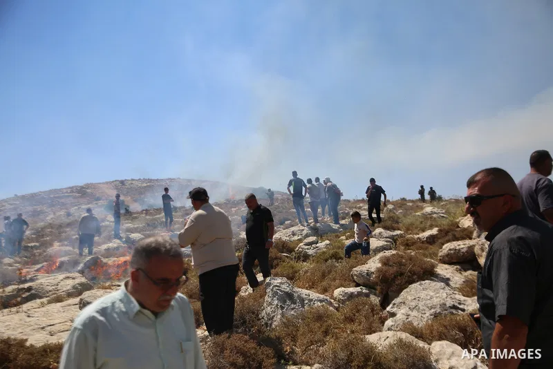 Palestinians take part in a protest against plans to confiscate land for settlement expansion in Khirbet Humsa, west of Hebron in the occupied West Bank, on June 9, 2026. Local sources said Israeli forces dispersed the d...