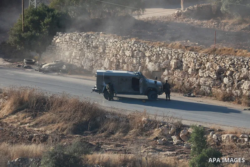 Israeli army vehicles place earth mounds and concrete blocks at roads and entrances to the town of Beit Ummar, north of Hebron in the occupied West Bank, on June 9, 2026. According to local sources, Israeli forces have c...