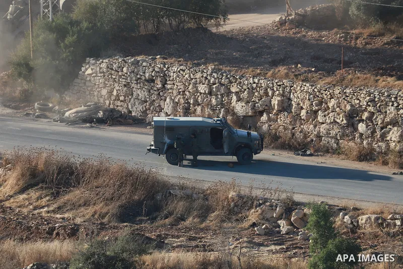 Israeli army vehicles place earth mounds and concrete blocks at roads and entrances to the town of Beit Ummar, north of Hebron in the occupied West Bank, on June 9, 2026. According to local sources, Israeli forces have c...