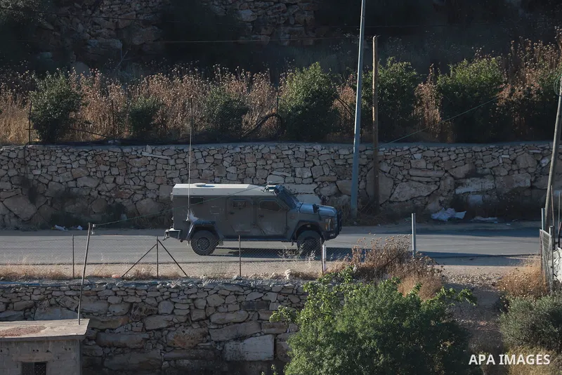 Israeli army vehicles place earth mounds and concrete blocks at roads and entrances to the town of Beit Ummar, north of Hebron in the occupied West Bank, on June 9, 2026. According to local sources, Israeli forces have c...