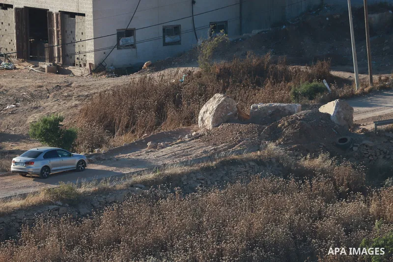 Israeli army vehicles place earth mounds and concrete blocks at roads and entrances to the town of Beit Ummar, north of Hebron in the occupied West Bank, on June 9, 2026. According to local sources, Israeli forces have c...