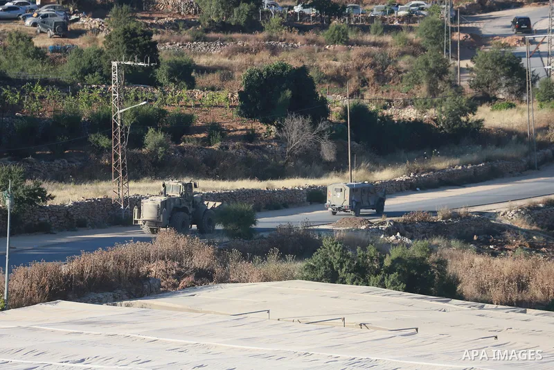 Israeli army vehicles place earth mounds and concrete blocks at roads and entrances to the town of Beit Ummar, north of Hebron in the occupied West Bank, on June 9, 2026. According to local sources, Israeli forces have c...