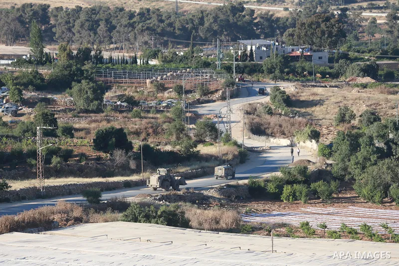 Israeli army vehicles place earth mounds and concrete blocks at roads and entrances to the town of Beit Ummar, north of Hebron in the occupied West Bank, on June 9, 2026. According to local sources, Israeli forces have c...