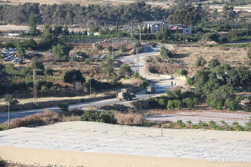 Israeli army vehicles place earth mounds and concrete blocks at roads and entrances to the town of Beit Ummar, north of Hebron in the occupied West Bank, on June 9, 2026. According to local sources, Israeli forces have c...