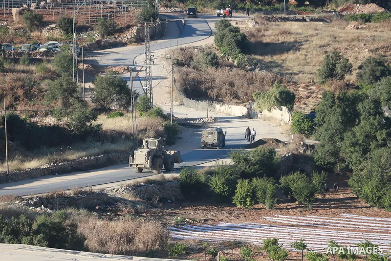Israeli army vehicles place earth mounds and concrete blocks at roads and entrances to the town of Beit Ummar, north of Hebron in the occupied West Bank, on June 9, 2026. According to local sources, Israeli forces have c...