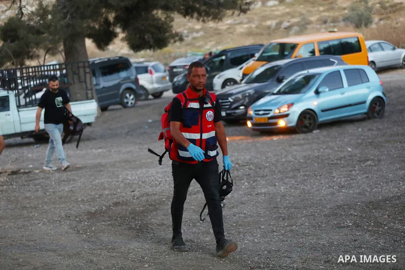 Palestinians run for cover as Israeli forces fire tear gas canisters toward visitors at the historic Solomon’s Pools area, south of Bethlehem in the occupied West Bank, on June 12, 2026. The incident occurred while peopl...
