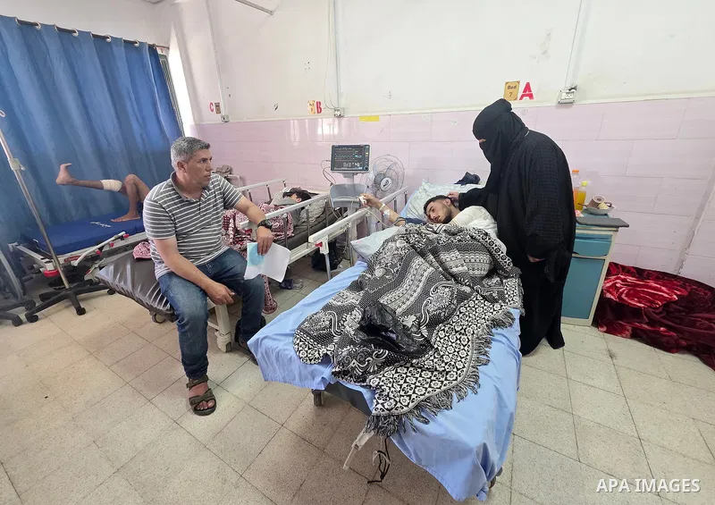 Palestinian fisherman Youssef al-Najjar lies on a hospital bed after being wounded by Israeli shelling while working at sea in the Gaza Strip, on June 16, 2026. Despite receiving an urgent medical referral, al-Najjar rem...
