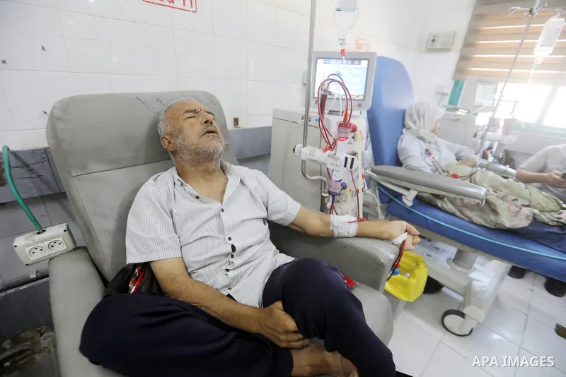 Patients with chronic kidney disease take part in a protest outside the Kidney Diseases Building at al-Shifa Hospital in Gaza City on June 30, 2026, protesting the reduction in the duration and number of dialysis session...