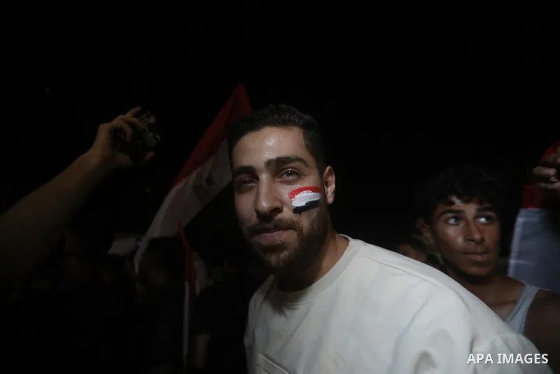 Palestinians watch a live broadcast of the FIFA World Cup Round of 32 football match between Egypt and Australia in Gaza City, on July 3, 2026. Residents gathered to follow the knockout-stage match on a public screen ami...