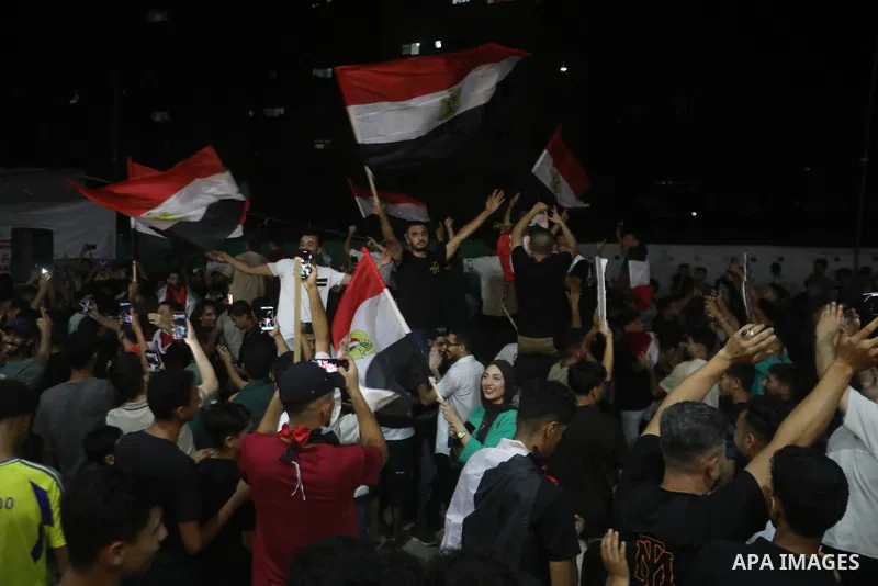 Palestinians watch a live broadcast of the FIFA World Cup Round of 32 football match between Egypt and Australia in Gaza City, on July 3, 2026. Residents gathered to follow the knockout-stage match on a public screen ami...