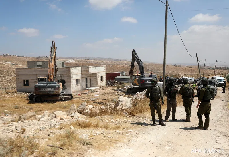 Palestinians inspect demolished homes after Israeli authorities carried out demolition operations in the Yatta area, south of Hebron, in the occupied West Bank, on July 7, 2026. According to local sources, several homes...