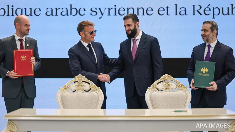 Syrian President Ahmad al-Sharaa and French President Emmanuel Macron hold a joint press conference at the People's Palace in Damascus on July 7, 2026, following expanded official talks on bilateral relations and ways to...
