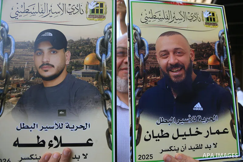 Palestinians take part in a solidarity demonstration in support of Palestinian prisoners in the West Bank city of Nablus on July 14, 2026. Participants waved Palestinian flags and carried placards calling for improved co...