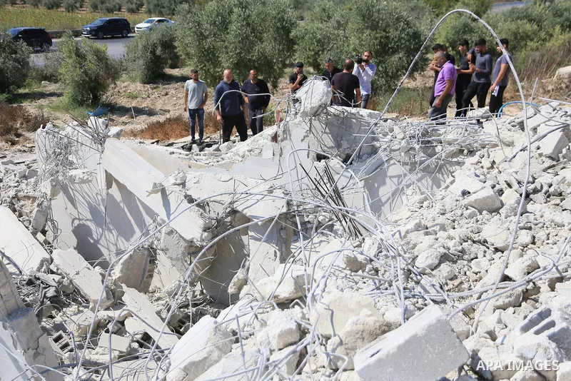 Palestinians gather around a home demolished by Israeli bulldozers in the village of Anza, south of Jenin in the occupied West Bank, on July 15, 2026. Photo by Mohammed Nasser\ apaimages