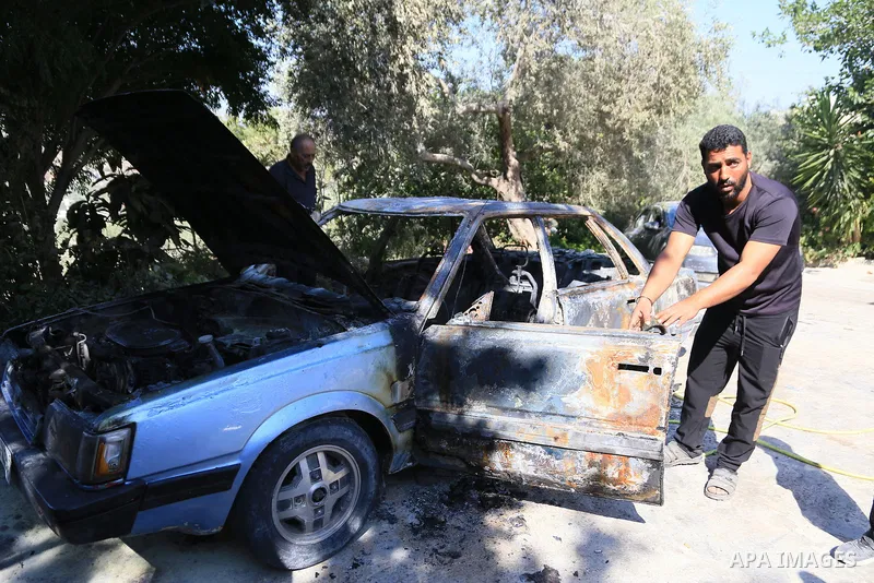 Palestinians inspect a burned car and tractor after they were set on fire by Jewish settlers in the village of Ramin, west of the West Bank city of Nablus, on July 16, 2026. Photo by Mohammed Nasser\ apaimages