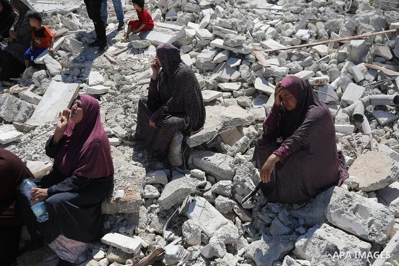 Palestinians sit on the rubble of a home demolished by Israeli forces in the town of Beit Awa, south of Hebron, in the occupied West Bank, on July 20, 2026. The house belonged to Ahmad Masalma, whose family inspected the...