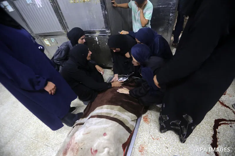 Mourners bid farewell to the bodies of Firas al-Masri, his wife, and their four children after they were killed in an Israeli airstrike that targeted a house belonging to the al-Masri family on al-Thalathini Street in Ga...