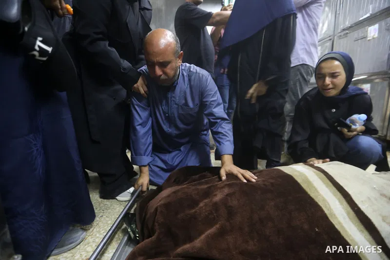 Mourners bid farewell to the bodies of Firas al-Masri, his wife, and their four children after they were killed in an Israeli airstrike that targeted a house belonging to the al-Masri family on al-Thalathini Street in Ga...