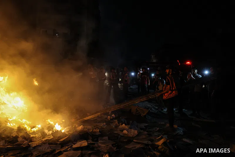 Palestinians inspect the damage to a building following an Israeli airstrike on al-Jalaa Street in central Gaza City, Gaza Strip, on July 23, 2026. Photo by Omar Ashtawy\ apaimages