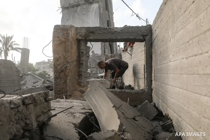 Palestinians inspect damage at Al-Noor Mosque following an attack in al-Bureij refugee camp, central Gaza Strip, on July 24, 2026. The damage comes despite an ongoing ceasefire, as places of worship and civilian faciliti...