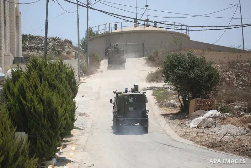 Israeli troops deploy during a military operation in the village of Tell, near the West Bank city of Nablus, on Saturday, July 25, 2026. Photo by Mohammed Nasser\ apaimages