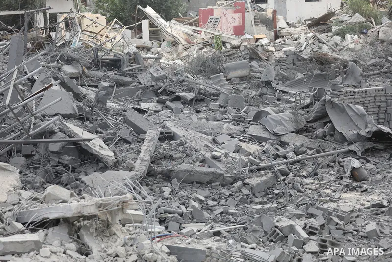 Palestinians inspect the damage caused by an Israeli airstrike that targeted a house belonging to the al-Qalqili family in al-Bureij refugee camp, in the central Gaza Strip, on July 30, 2026. Photo by Hassan al-Jedi \ ap...