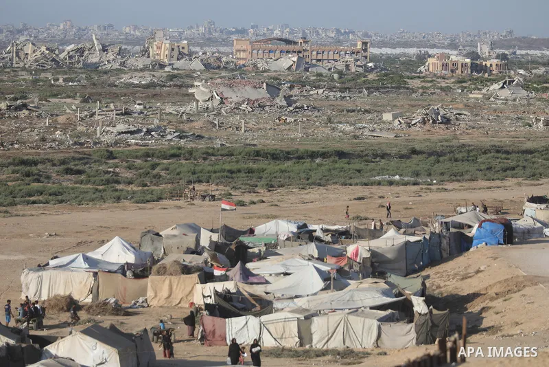 Palestinians take part in the final match of a football tournament organized by young people living in temporary tents sheltering displaced families in Nuseirat refugee camp, central Gaza Strip, on August 1, 2026. Held i...