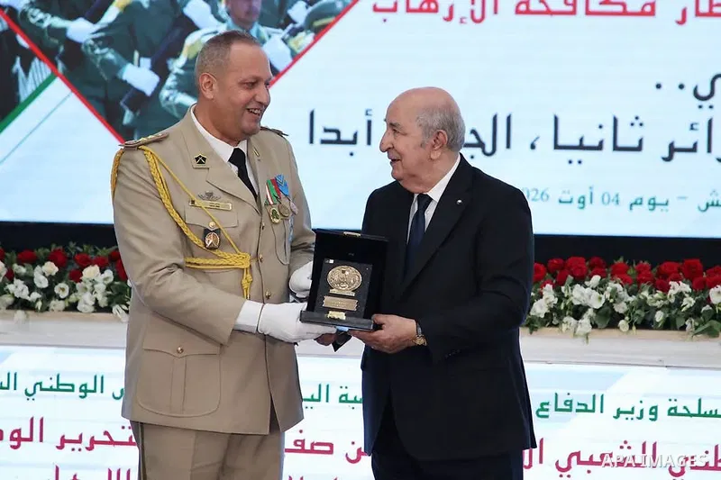 Algerian President Abdelmadjid Tebboune, commander-in-chief of the Armed Forces and minister of national defense, attends a ceremony marking National People's Army Day at the National Army Club in Beni Messous, Algiers,...