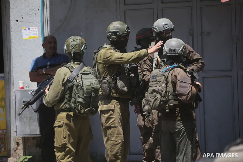 Israeli forces carry out a military raid in the Askar refugee camp, east of the West Bank city of Nablus, on August 6, 2026, as soldiers deploy throughout the camp's streets and conduct search operations. Photo by Mohamm...
