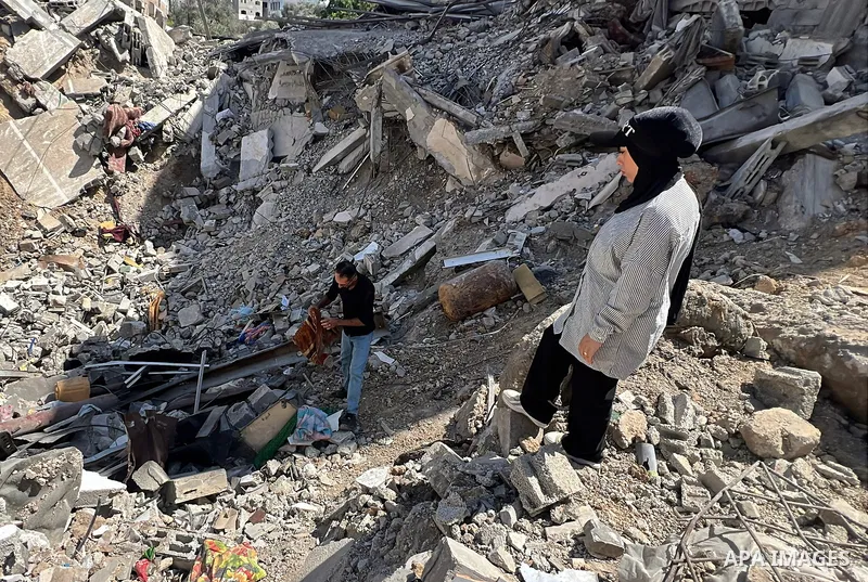 Palestinian bride Aya Matran sits on the rubble of the home where she had planned to live after her wedding in the Maghazi refugee camp, central Gaza Strip, on August 6, 2026. Matran said the house was destroyed in an Is...