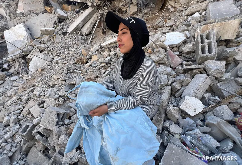 Palestinian bride Aya Matran sits on the rubble of the home where she had planned to live after her wedding in the Maghazi refugee camp, central Gaza Strip, on August 6, 2026. Matran said the house was destroyed in an Is...