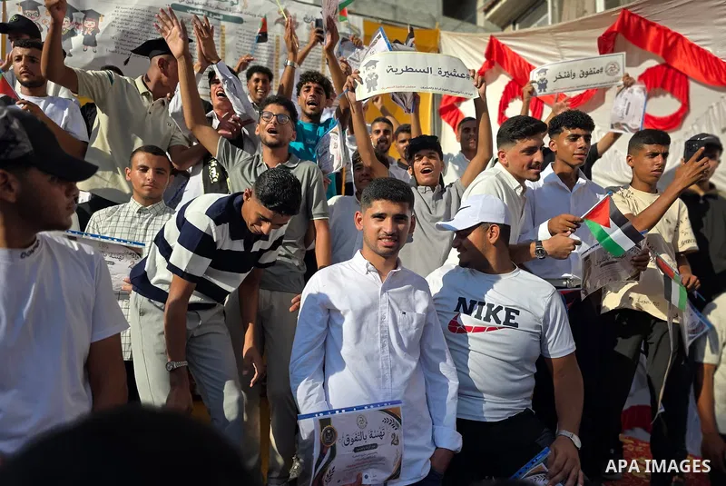 Top-performing Palestinian high school students attend a recognition ceremony organized by community groups in Khan Younis, southern Gaza Strip, alongside their families, on August 6, 2026. The event honored 140 students...