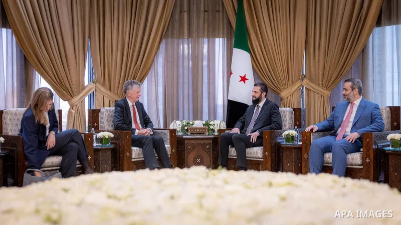 Syrian President Ahmad al-Sharaa meets British National Security Adviser Jonathan Powell, in the presence of Foreign Affairs and Expatriates Minister Asaad al-Shaibani, in Damascus, Syria, on August 8, 2026. Photo by Syr...