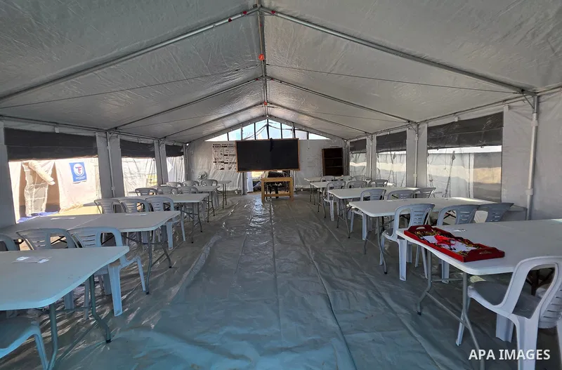 Palestinians attend the opening of the new Shafa Amr School in the al-Mawasi area of Khan Younis, in the southern Gaza Strip, on August 23, 2026. The school aims to restore access to education for students who have been...