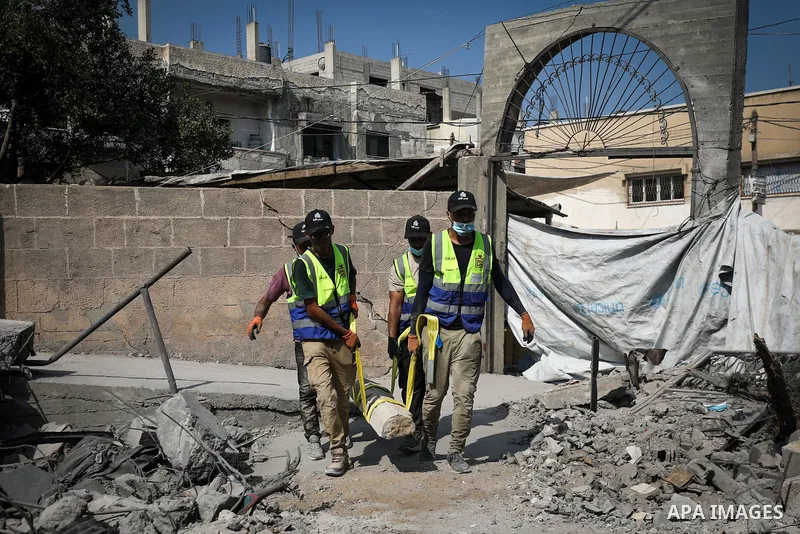 Volunteers from the “Humat al-Turath” team carry out restoration work as part of an initiative to protect the historic Abu Salim Mosque, which was recently damaged in an Israeli airstrike, in Deir al-Balah, central Gaza...