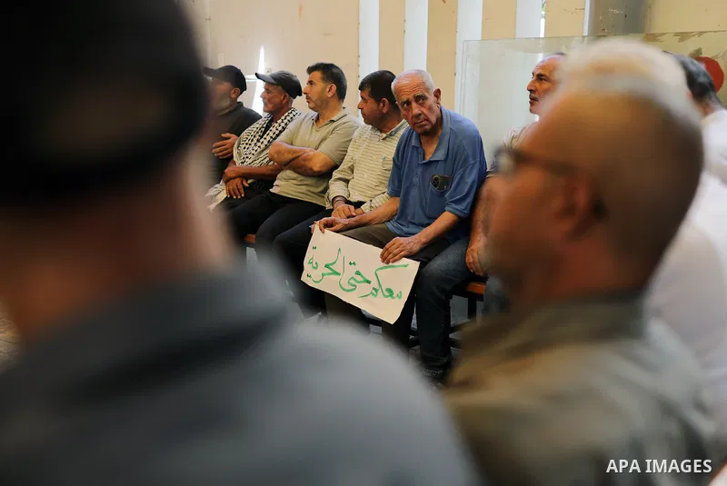 Relatives of Palestinian prisoners take part in a weekly sit-in outside the International Committee of the Red Cross office in Gaza City on August 31, 2026, calling for information about the fate of their relatives and t...