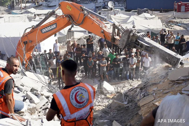 Rescuers excavate rubble to retrieve bodies from a collapsed building in the Tal al-Hawa area of Gaza City on September 16, 2026. Gaza's civil defence agency said rescuers were searching for dozens of missing people afte...