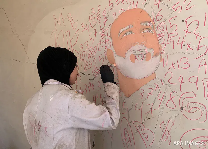 Palestinian artist Aseel Nasman creates artwork on the rubble of destroyed homes in the Gaza Strip on September 24, 2026. Nasman uses her art to portray international figures who have expressed support for Palestinians,...