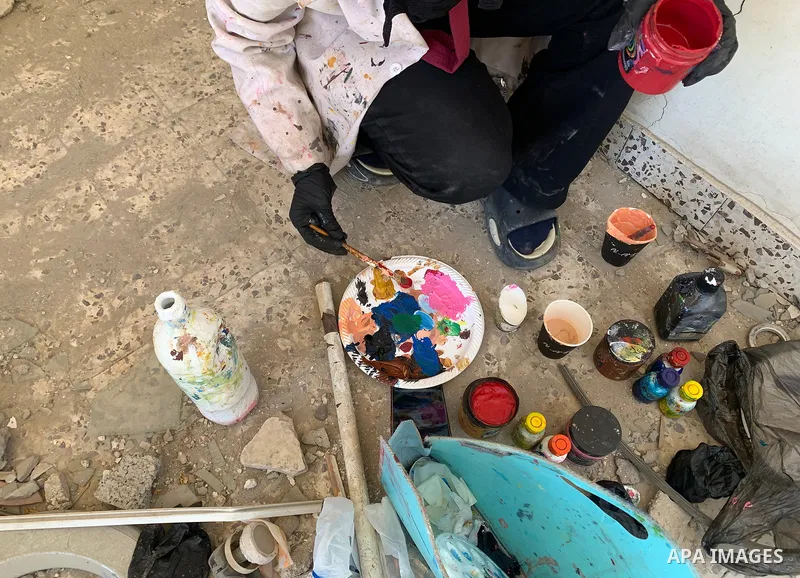 Palestinian artist Aseel Nasman creates artwork on the rubble of destroyed homes in the Gaza Strip on September 24, 2026. Nasman uses her art to portray international figures who have expressed support for Palestinians,...
