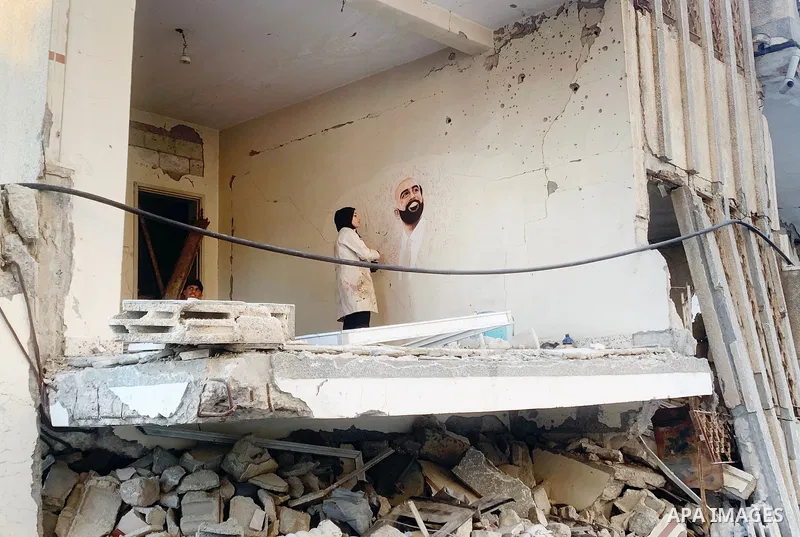 Palestinian artist Aseel Nasman creates artwork on the rubble of destroyed homes in the Gaza Strip on September 24, 2026. Nasman uses her art to portray international figures who have expressed support for Palestinians,...