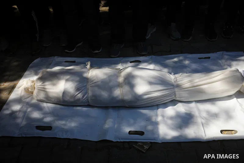 Mourners bid farewell to the bodies of five Palestinians in Gaza City on September 30, 2026, after they were killed in an Israeli strike targeting a vehicle pulling a cart used to transport civilians in the Tel al-Hawa n...