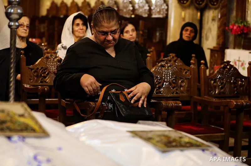 People gather during the funeral of two Palestinian Christian women at the Greek Orthodox Church of Saint Porphyrius in Gaza City, on October 3, 2026. Maysaa Khader Ibrahim Abu Daoud and her daughter, Maria Hafez Michel...