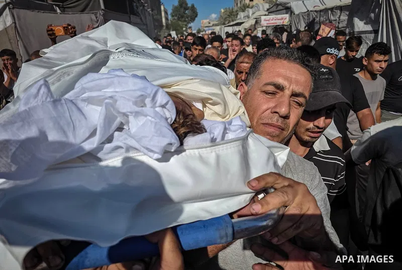 Palestinians attend the funeral of 14-year-old Nimer Barbakh at Nasser Medical Complex in Khan Younis, in the southern Gaza Strip, on October 7, 2026, after he died of wounds sustained from a gunshot that his family said...