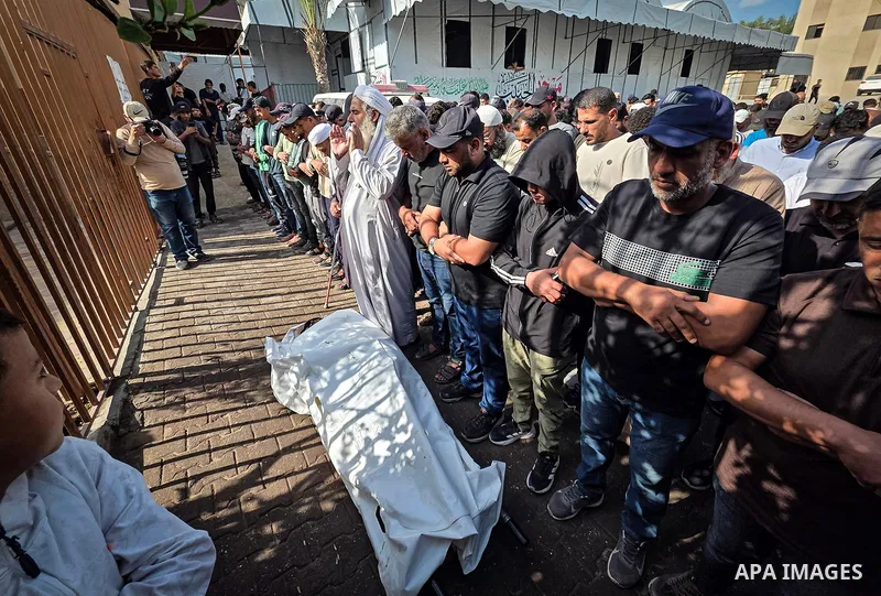 Palestinians bid farewell to the body of Mohammed Abu Shalouf during his funeral at Nasser Medical Complex in Khan Younis, in the southern Gaza Strip, on October 8, 2026. He was killed in an Israeli airstrike that target...