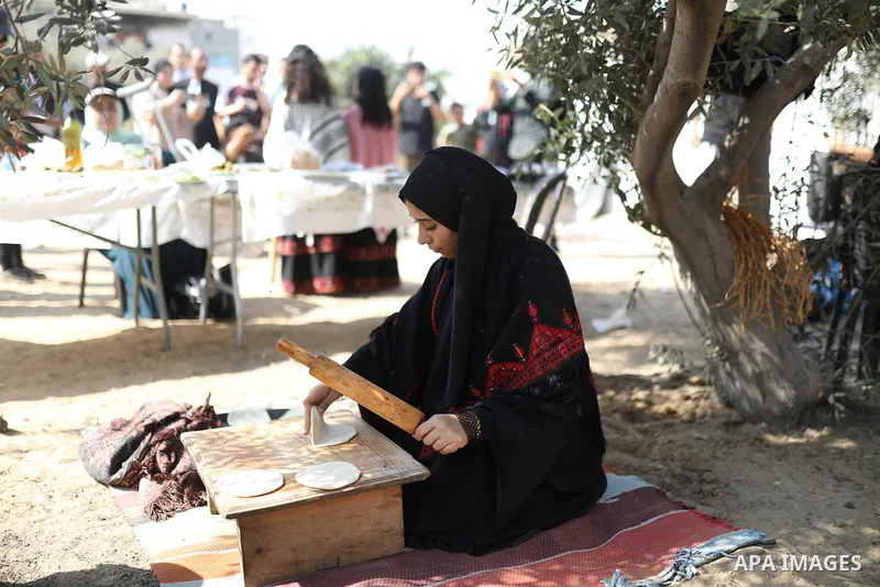 Palestinians take part in an olive harvesting event organized by the Hayat Volunteer Team on October 10, 2026. The event aims to preserve Palestinian heritage and strengthen ties to the land and olive trees through tradi...