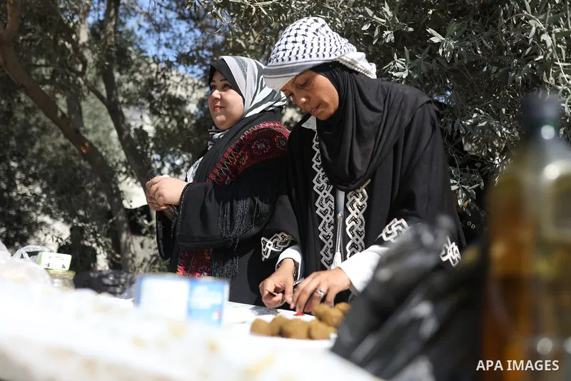 Palestinians take part in an olive harvesting event organized by the Hayat Volunteer Team on October 10, 2026. The event aims to preserve Palestinian heritage and strengthen ties to the land and olive trees through tradi...