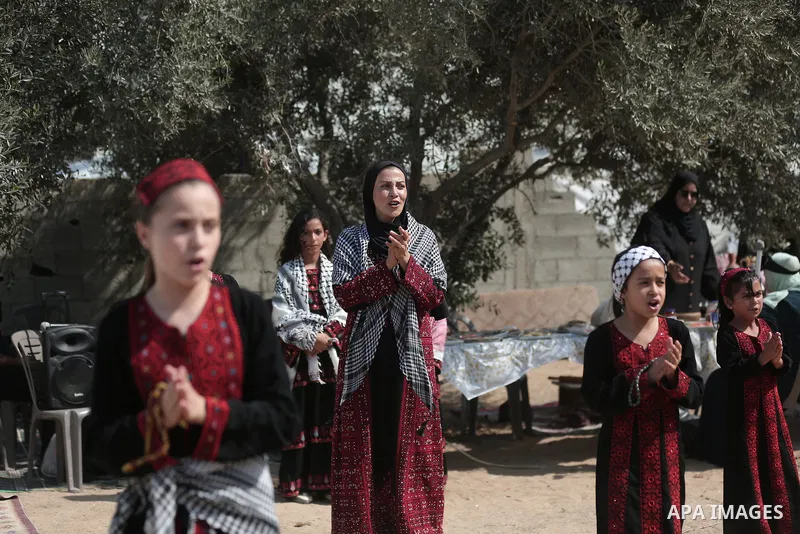 Palestinians take part in an olive harvesting event organized by the Hayat Volunteer Team on October 10, 2026. The event aims to preserve Palestinian heritage and strengthen ties to the land and olive trees through tradi...