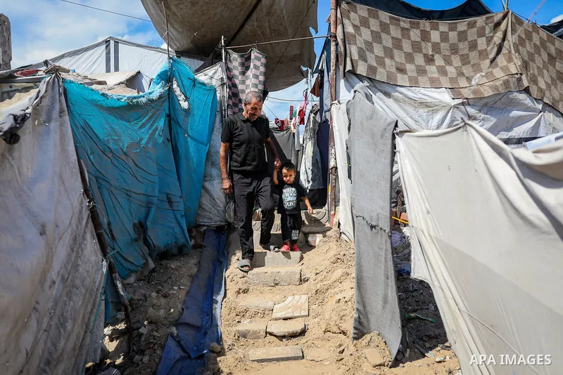 Displaced Palestinian children spend time and carry out daily activities in Gaza City, in the Gaza Strip, on October 12, 2026, amid harsh living conditions caused by the war and repeated displacement as the war enters it...